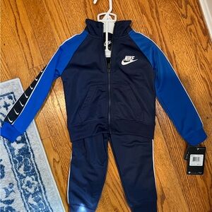 Nike track suit 2-piece set in 2T.  New with tags, never worn!